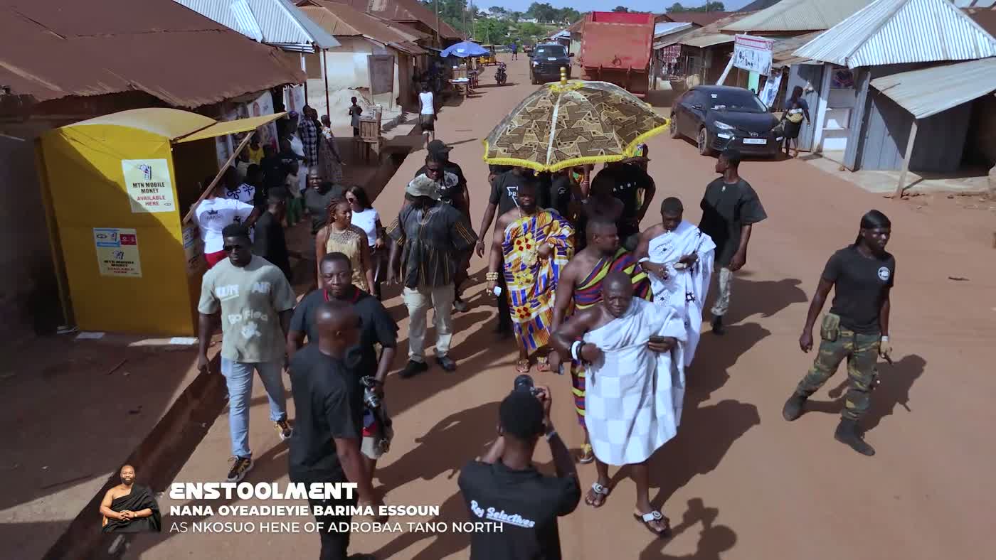Procession through Adrobaa beneath the royal umbrella during the enstoolment